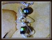 Example: Green/blue glass wire wrapped pendant I also have made a pair of matching earrings.