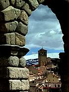 Completing Chapter 16 of Memoir by a Roman Aqueduct in Segovia Spain. Segovia is part of the land of La Mancha, famously rendered by Cervantes' Don...