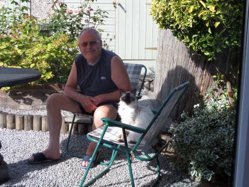 Daddy with Coco in the garden.
